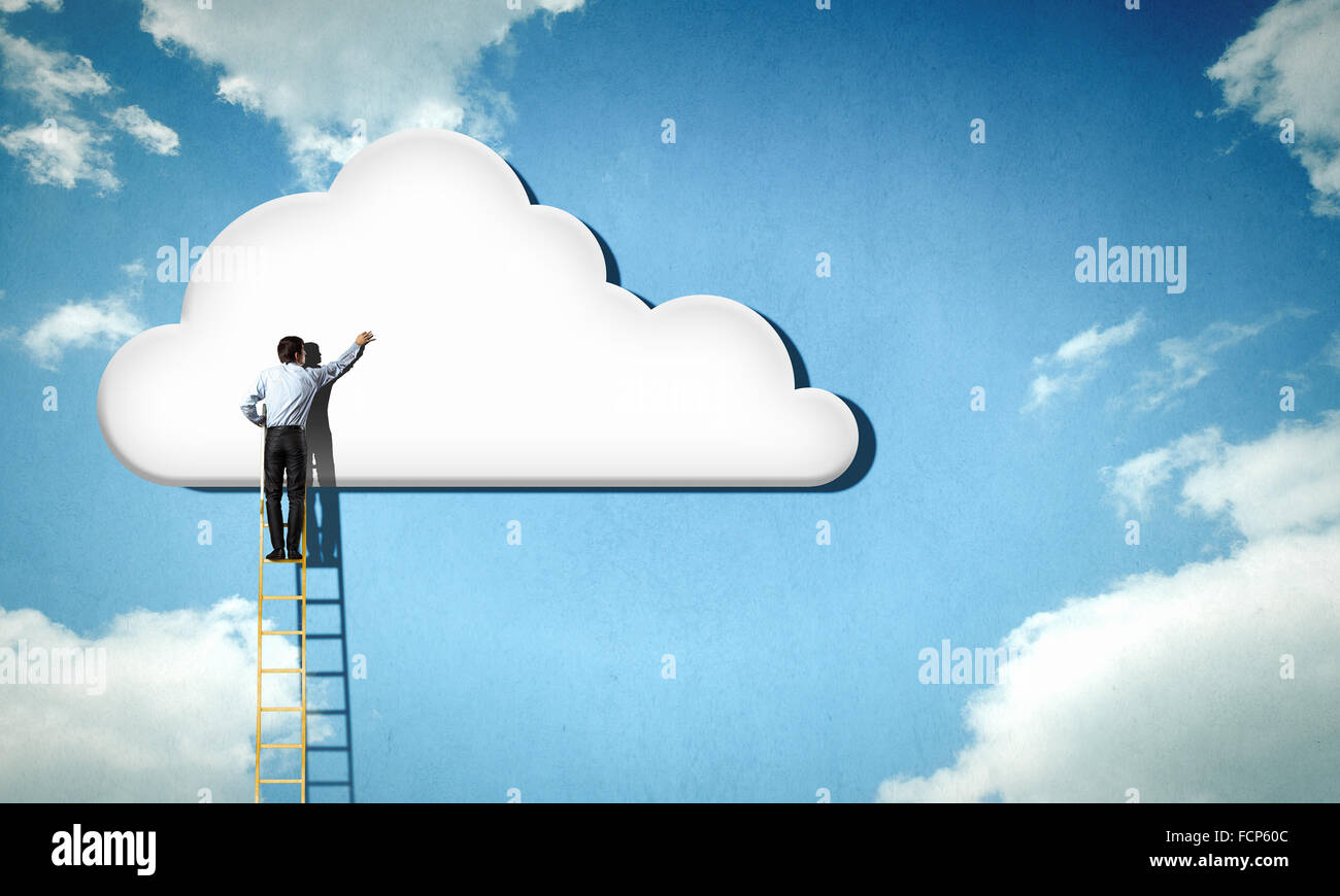 Back view of businessman standing on ladder and reaching to cloud Stock ...