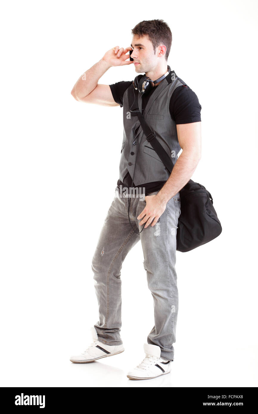 Full length portrait of a smiling school boy holding books and talking ...