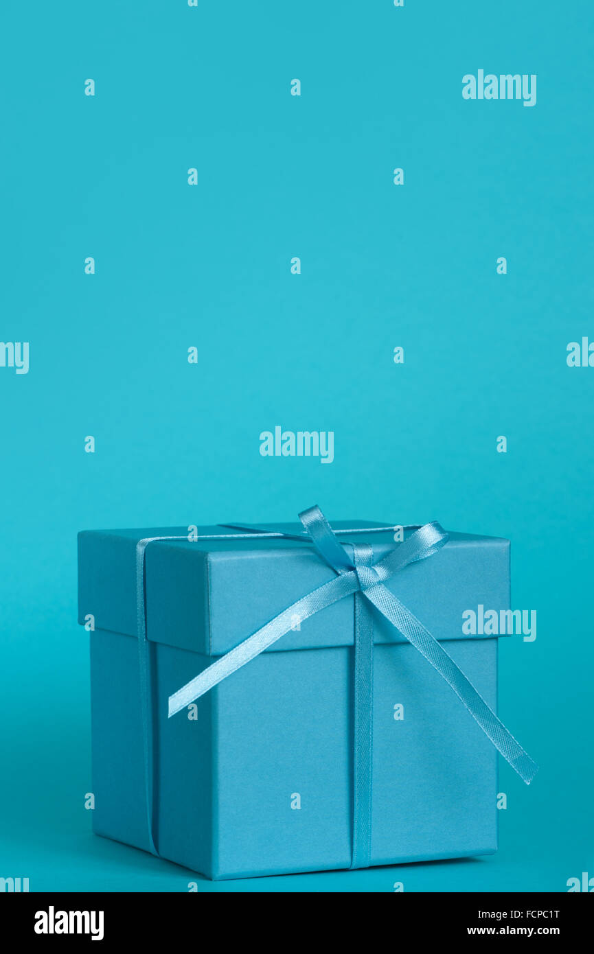 Blue gift box with ribbon Stock Photo - Alamy