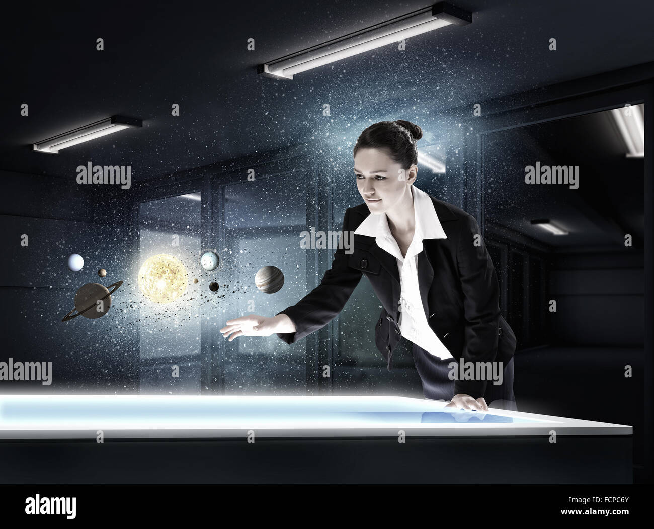 Young businesswoman and planets of space spinning around Stock Photo ...