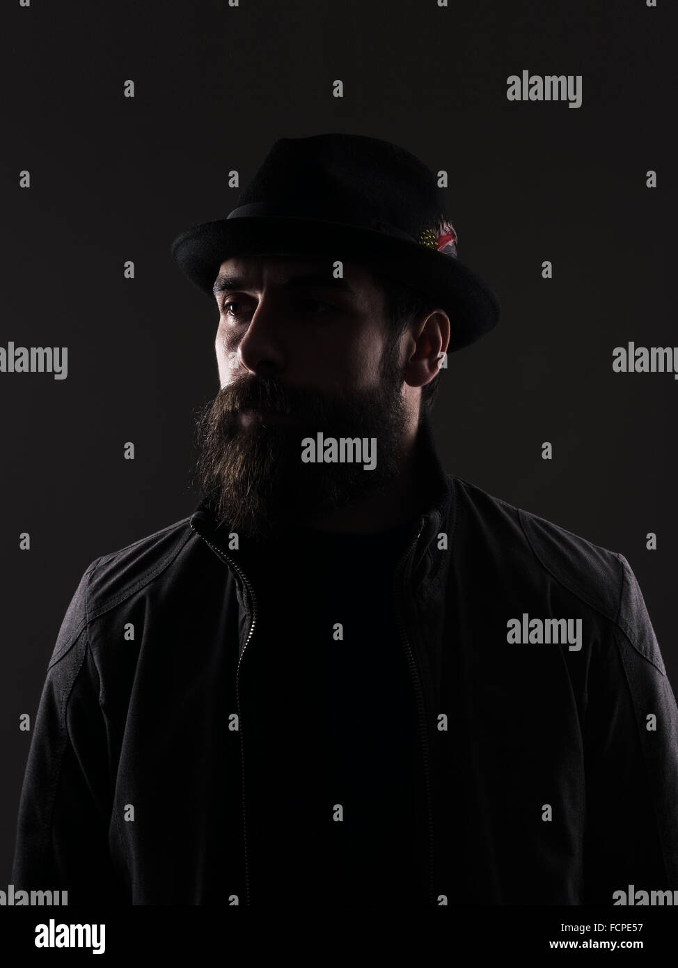 Suspicious man in black hat hi-res stock photography and images - Alamy
