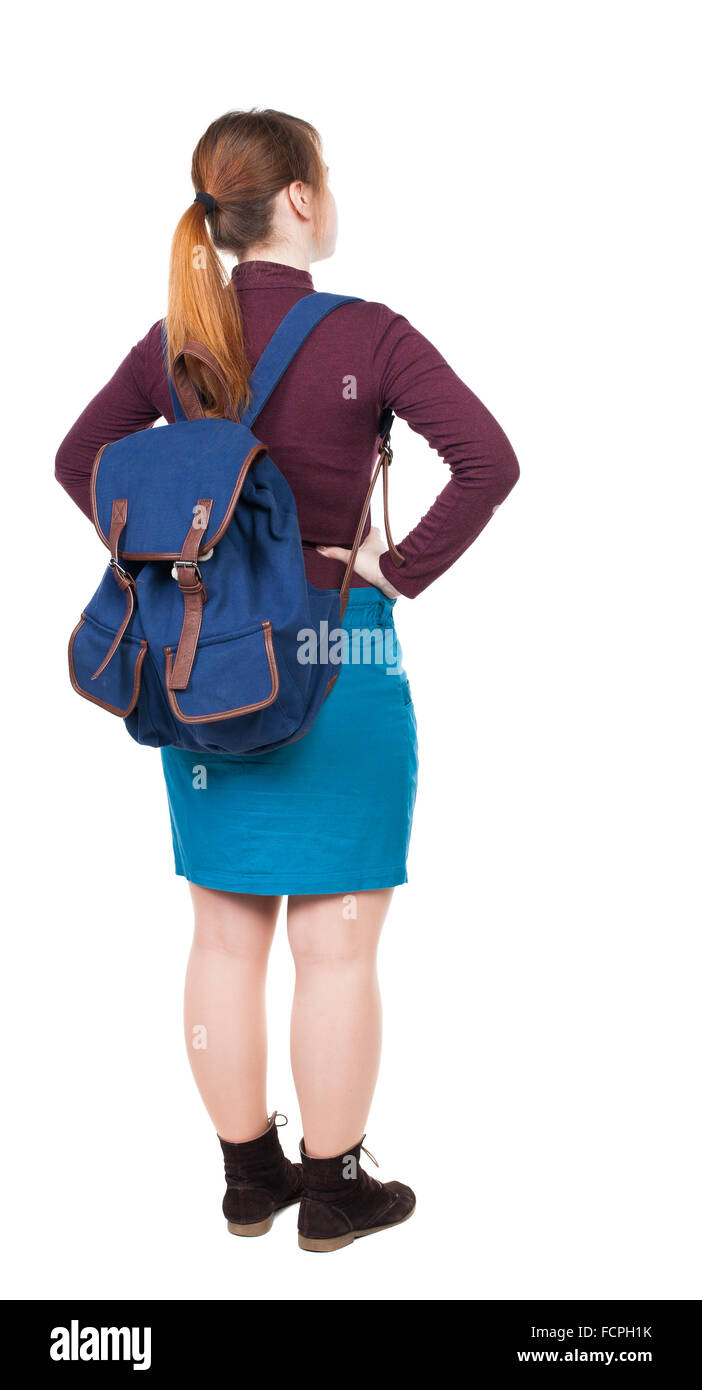Back view of woman with backpack looking up. Standing young girl