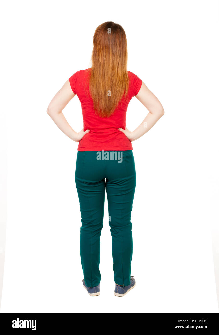back view of standing young beautiful woman in jeans. girl watching. Rear view people collection