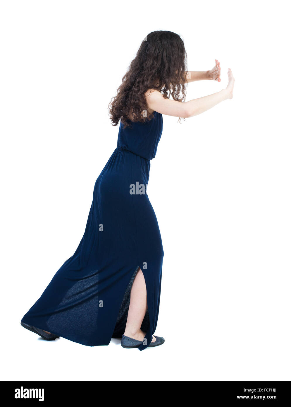 Pushing Back View back view of woman pushes wall. Isolated over white background. Rear ...
