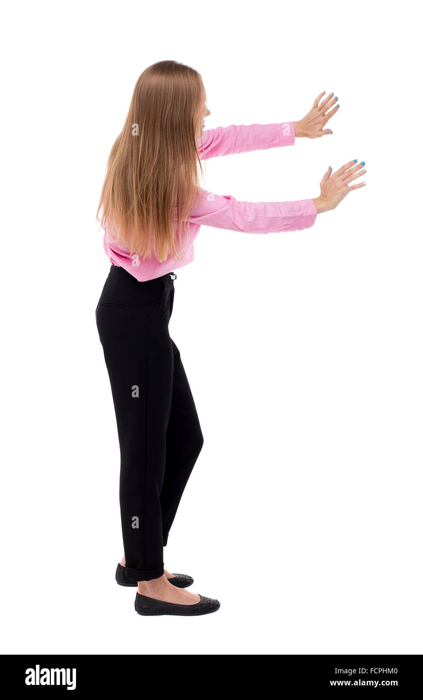 Pushing Back View back view of business woman pushes wall. Isolated over white background ...