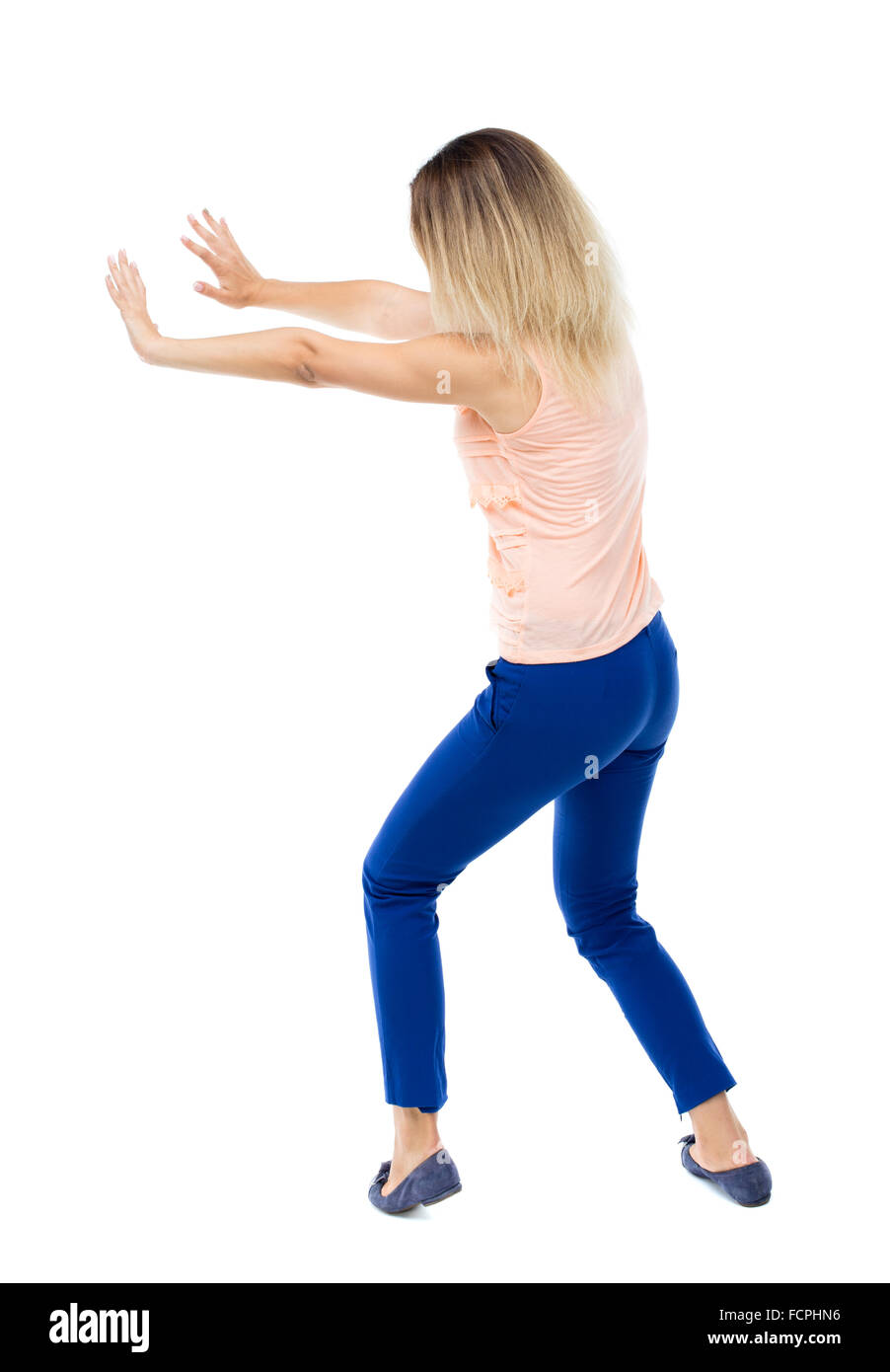 Pushing Back View back view of woman pushes wall. Isolated over white background. Rear ...