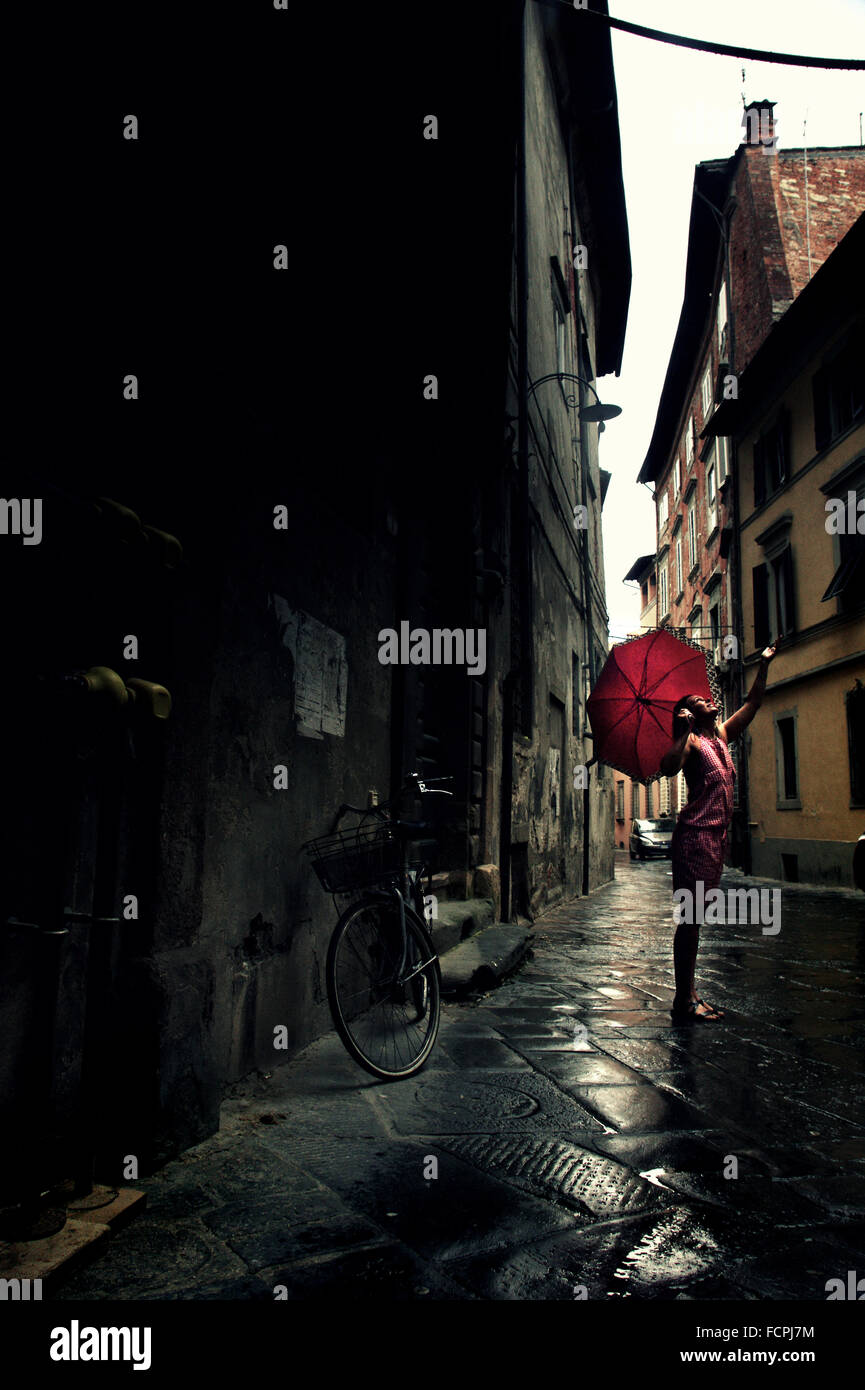 Girl with red umbrella hires stock photography and images Alamy