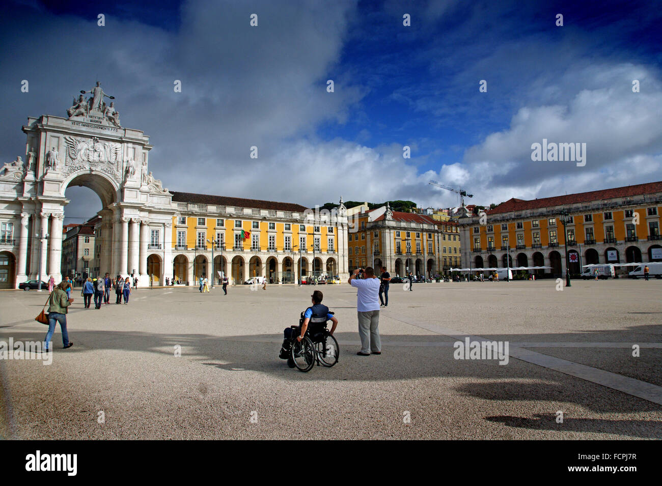 Man in wheelchair on a square in Lisbon Stock Photo Alamy