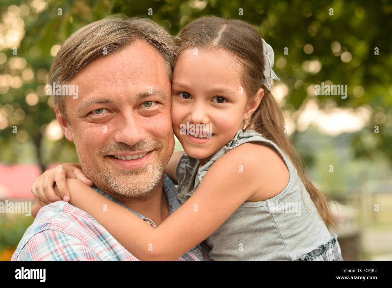 father with daughter in summer park Stock Photo - Alamy