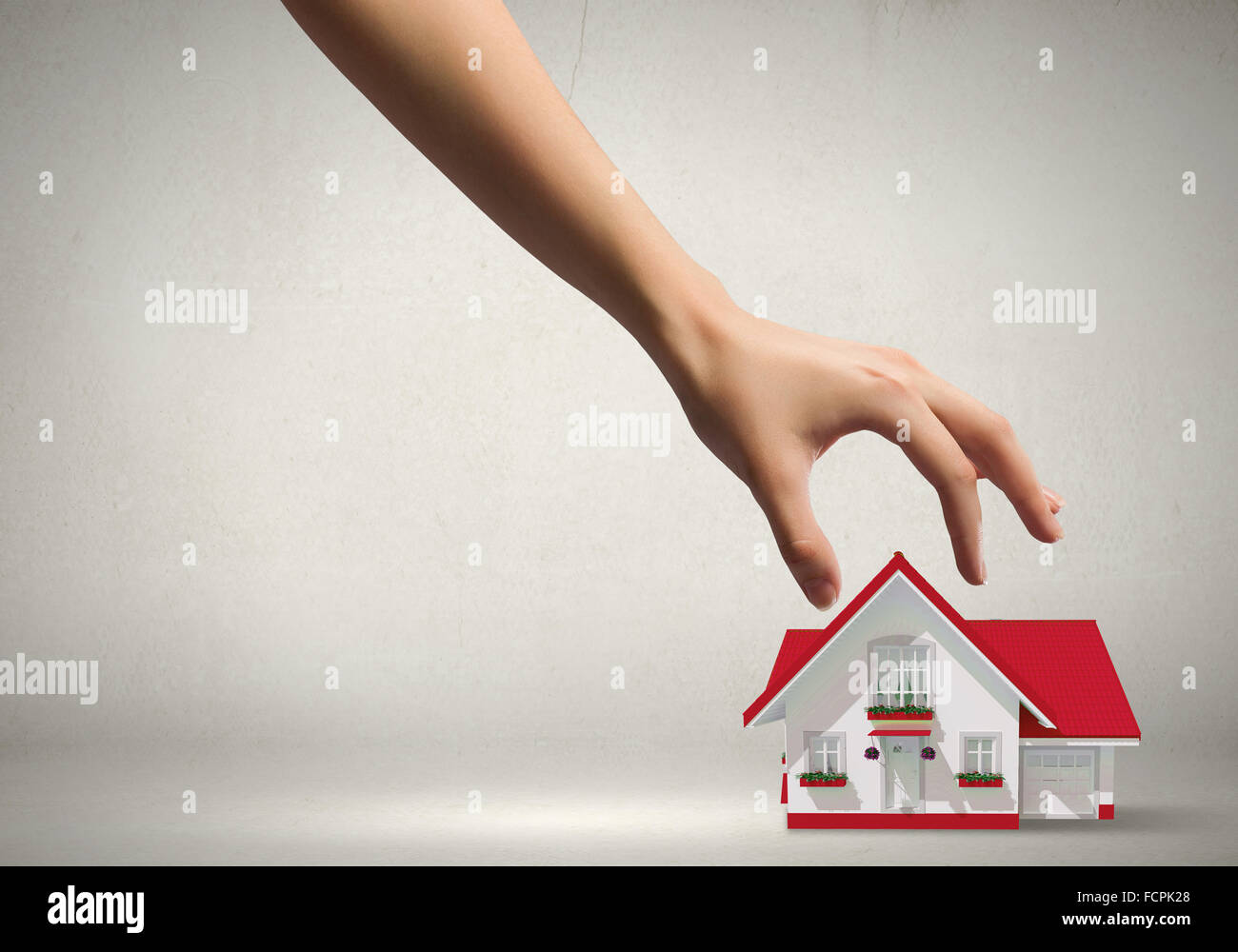 Human hand grabs drawn on paper house Stock Photo - Alamy