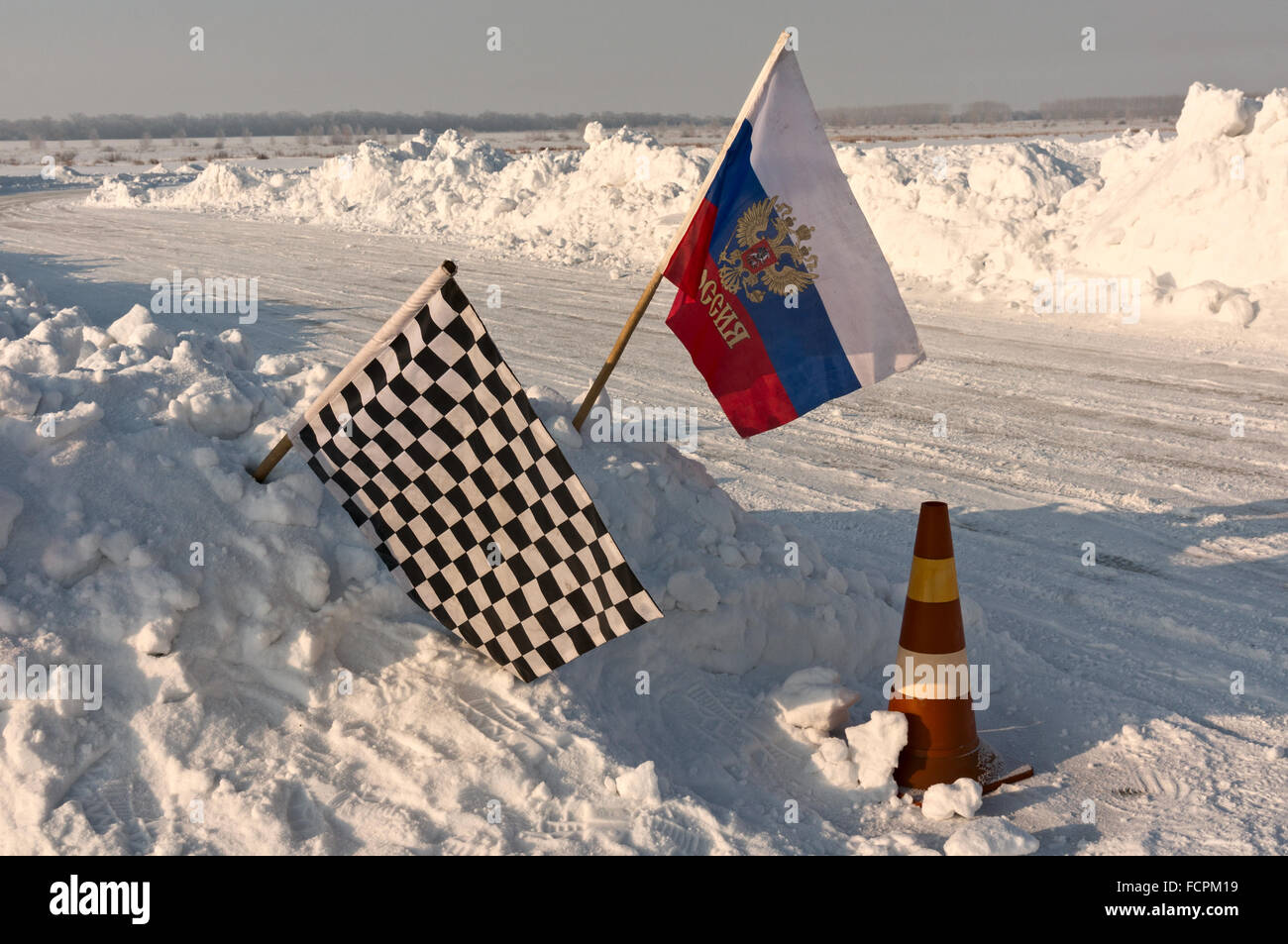 Chequered flag at ice-racing finish point Stock Photo