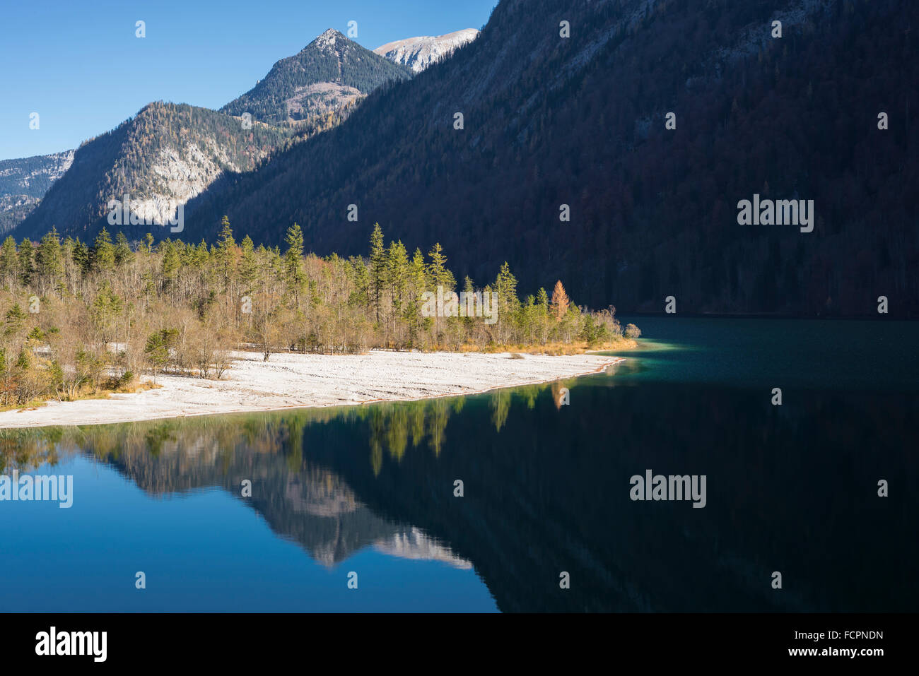 Gravel delta of the Ice Creek at Lake Koenigssee near St Bartholomae church in the Berchtesgaden National Park in the morning su Stock Photo