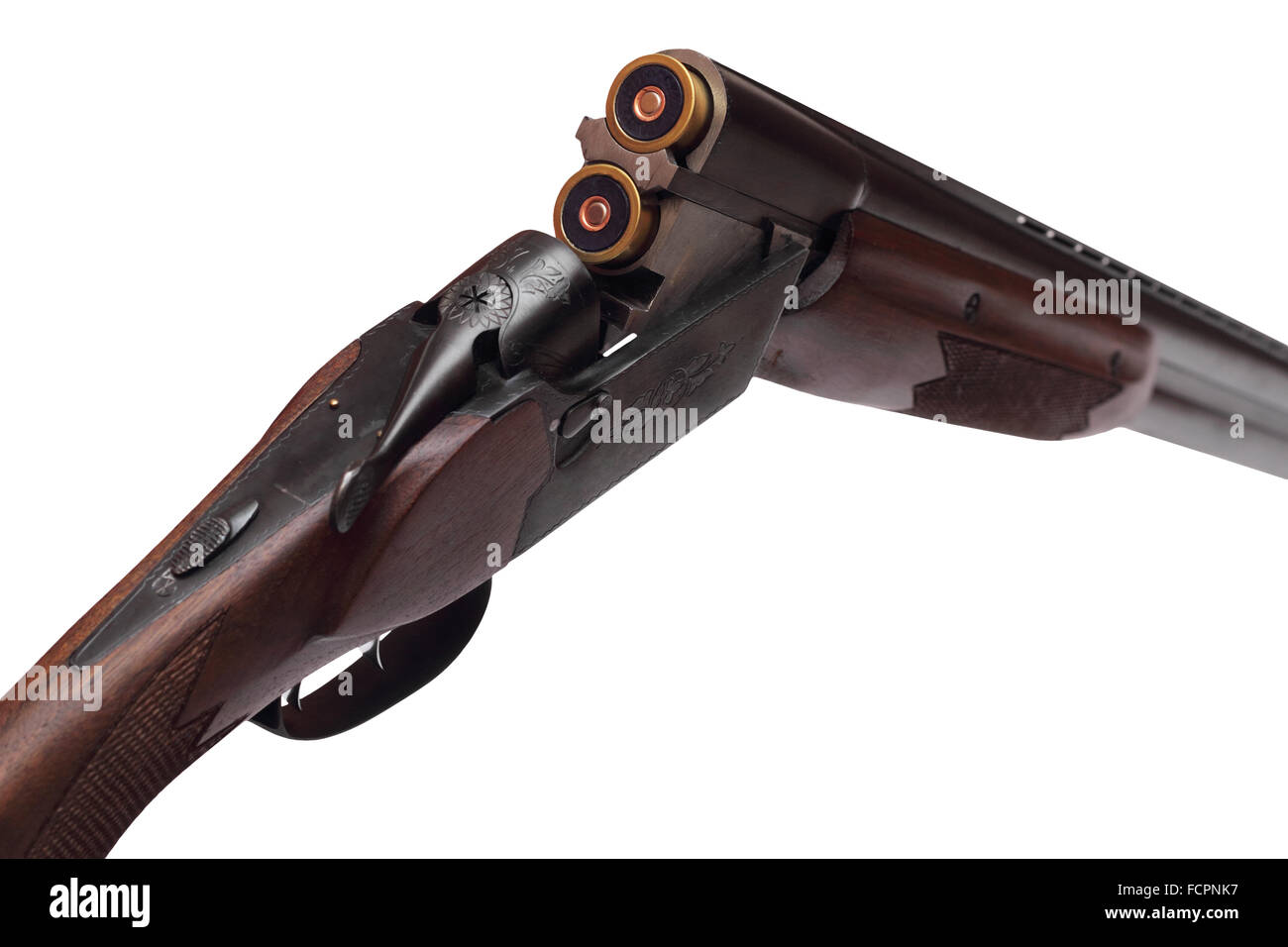 Opened doublebarrelled hunting gun with two blue cartridges right rear