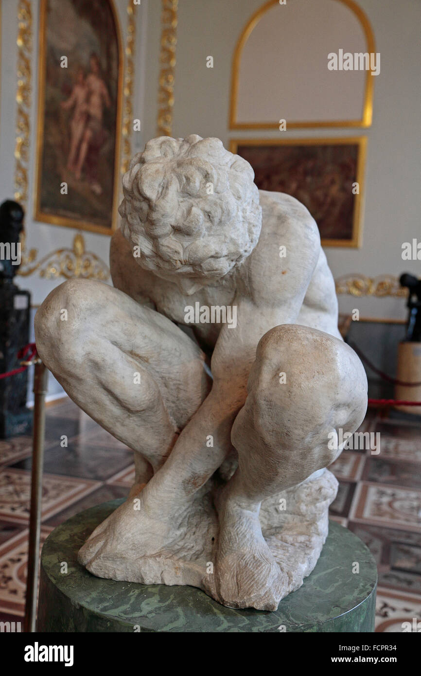 "Crouching Boy" by Michaelangelo Buonarroti in the State Hermitage museum, St Petersburg, Russia. Stock Photo
