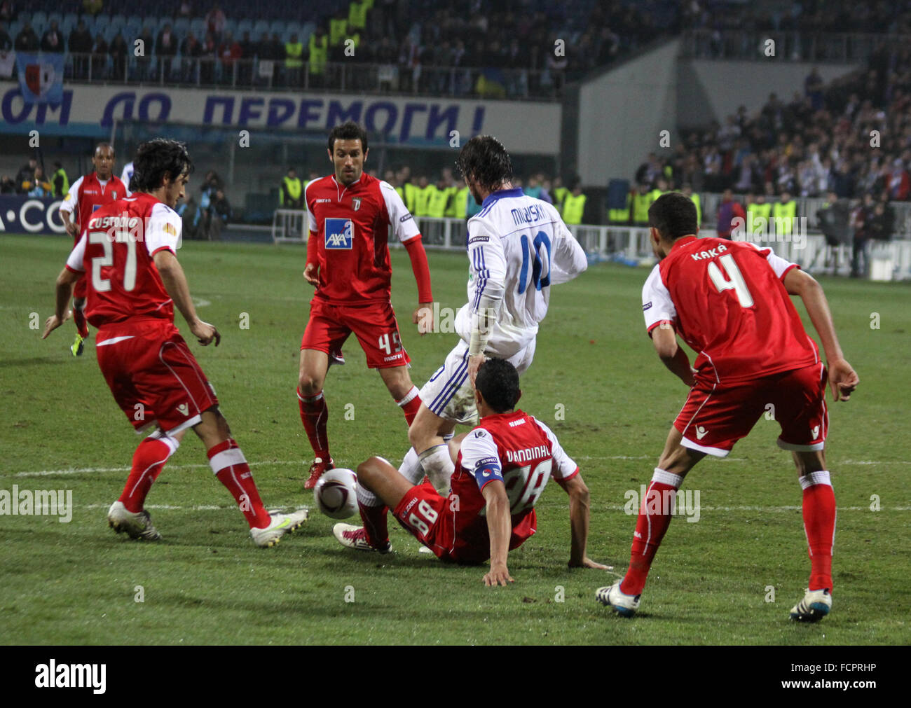 KYIV, UKRAINE - APRIL 7, 2011: Artem Milevskiy of Dynamo Kyiv (in white) fights for the ball with SC Braga players during their UEFA Europa League game on April 7, 2011 in Kyiv, Ukraine Stock Photo