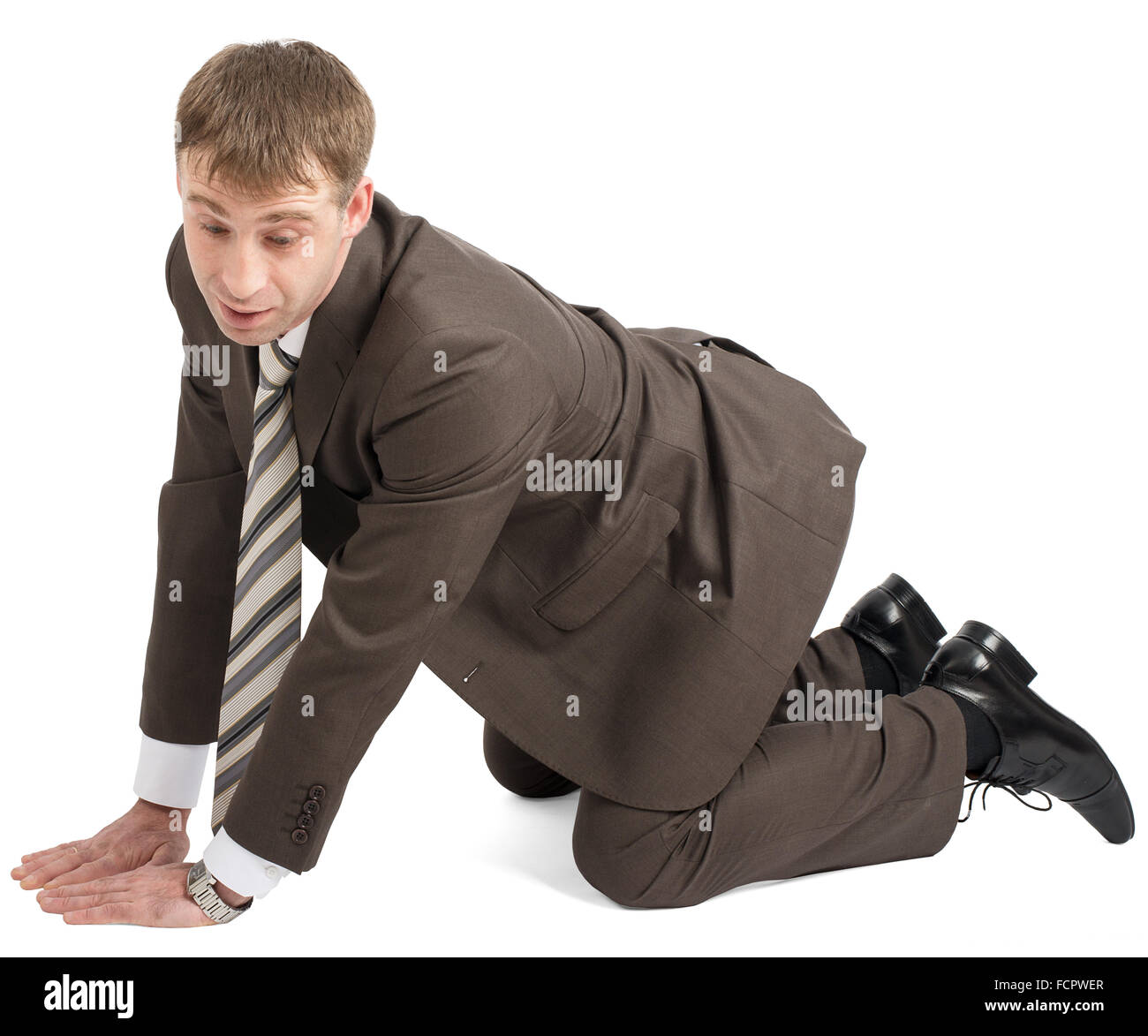 Businessman on knees and arms Stock Photo