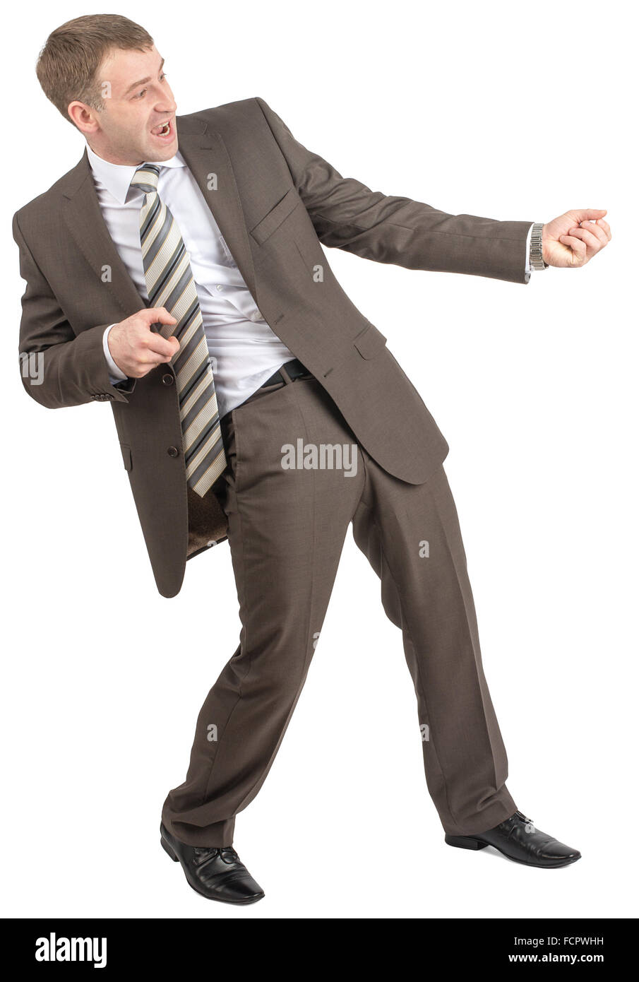 Businessman pulling invisible rope Stock Photo - Alamy