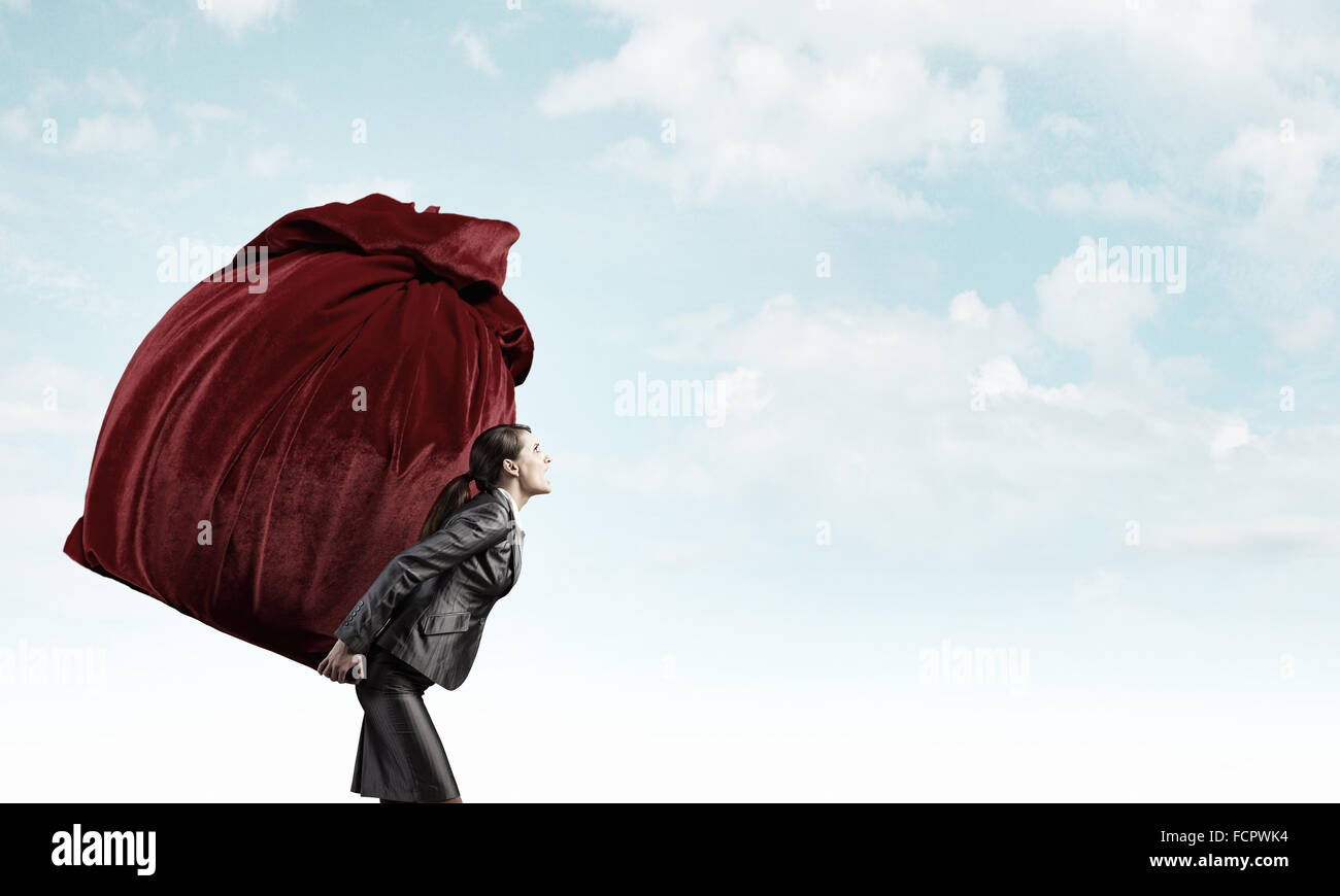 Businesswoman carrying big heavy bag on back Stock Photo Alamy