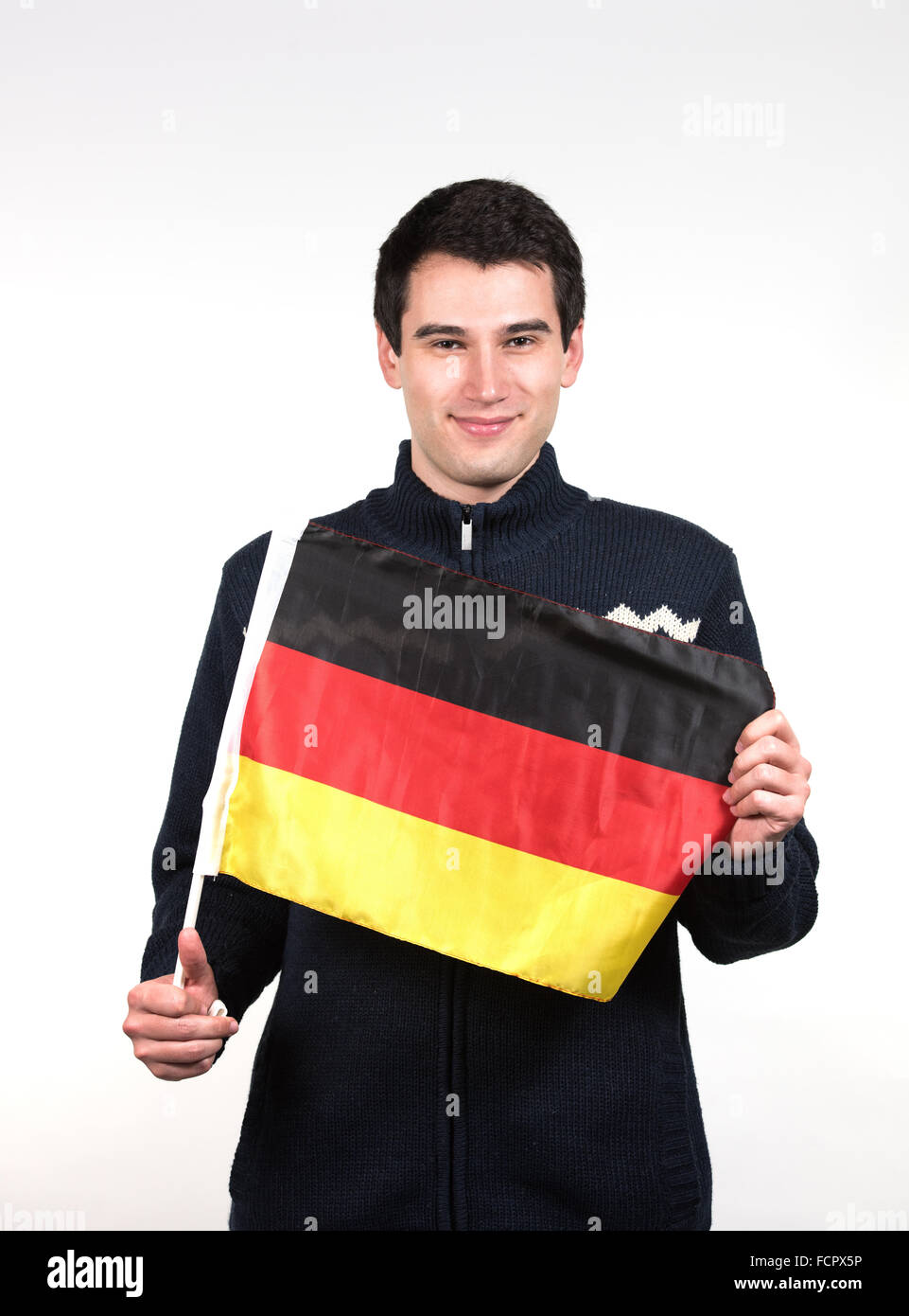 Young Man Wearing Winter Clothes Holding German Flag Stock Photo Alamy