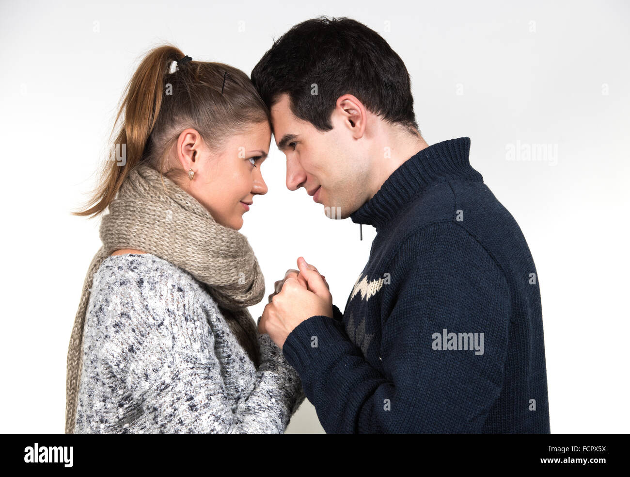 portraits of young couple in love, man and woman, wearing winter clothes Stock Photo