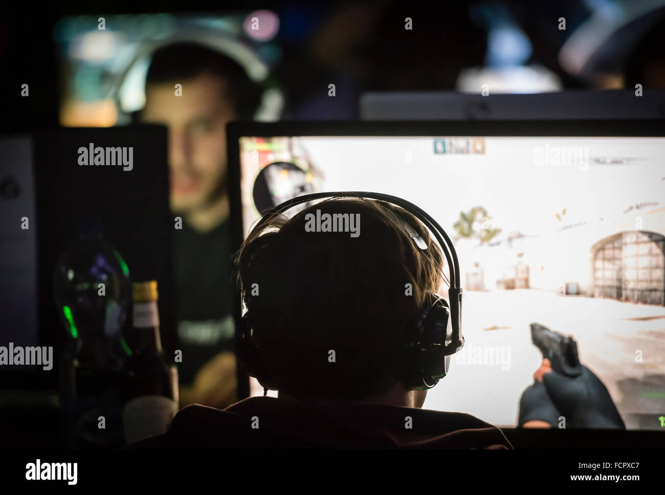 A computer game player is playing the first person shooter 'Counterstrike CS:GO' at a computer game convention. Stock Photo