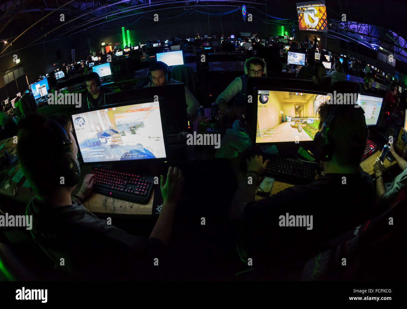 Computer game players are playing the first person shooter 'Counterstrike CS:GO' at a computer game tournament. Stock Photo