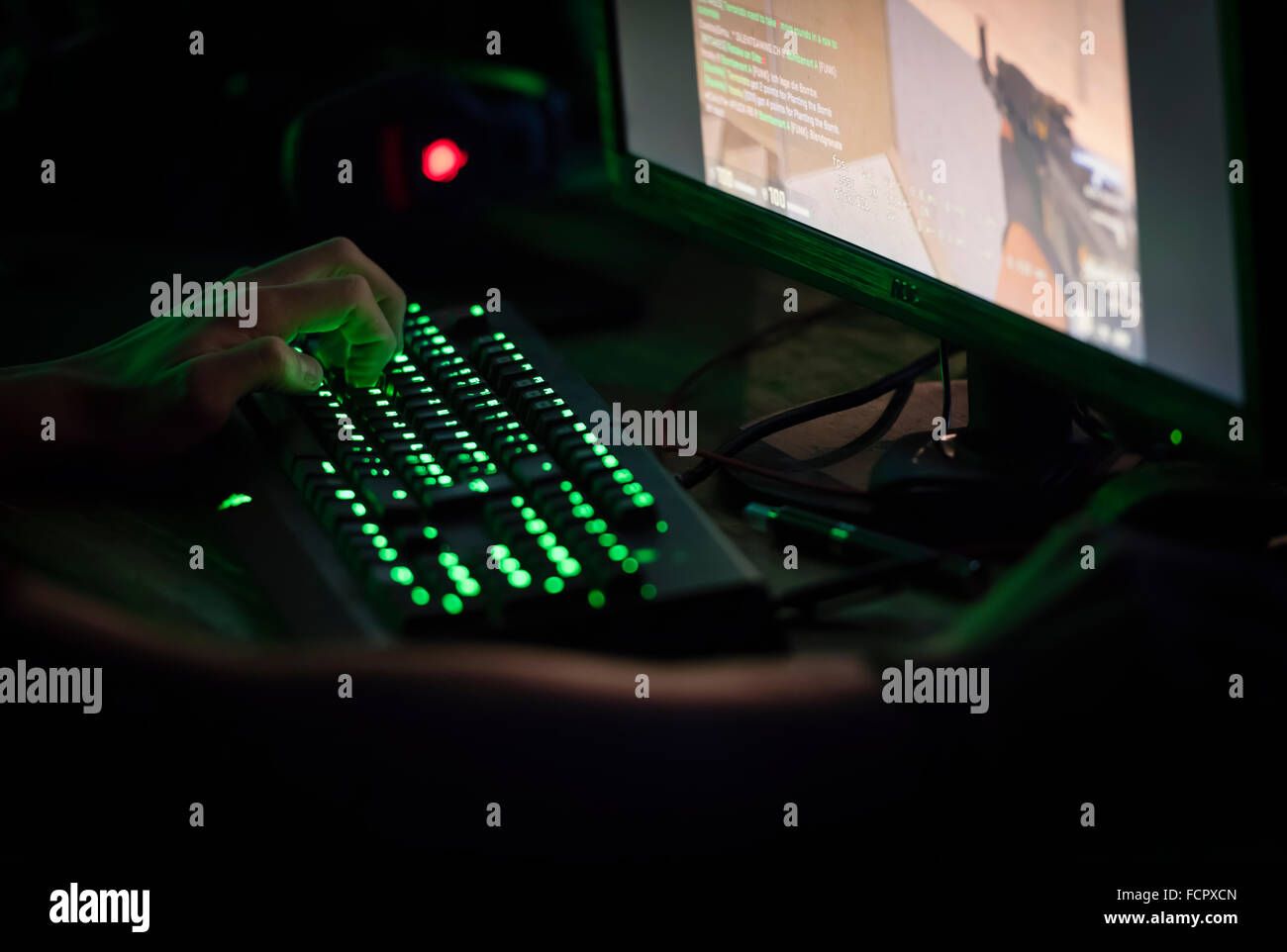 A computer game player is playing the first person shooter 'Counterstrike CS:GO' at a computer game convention. Stock Photo