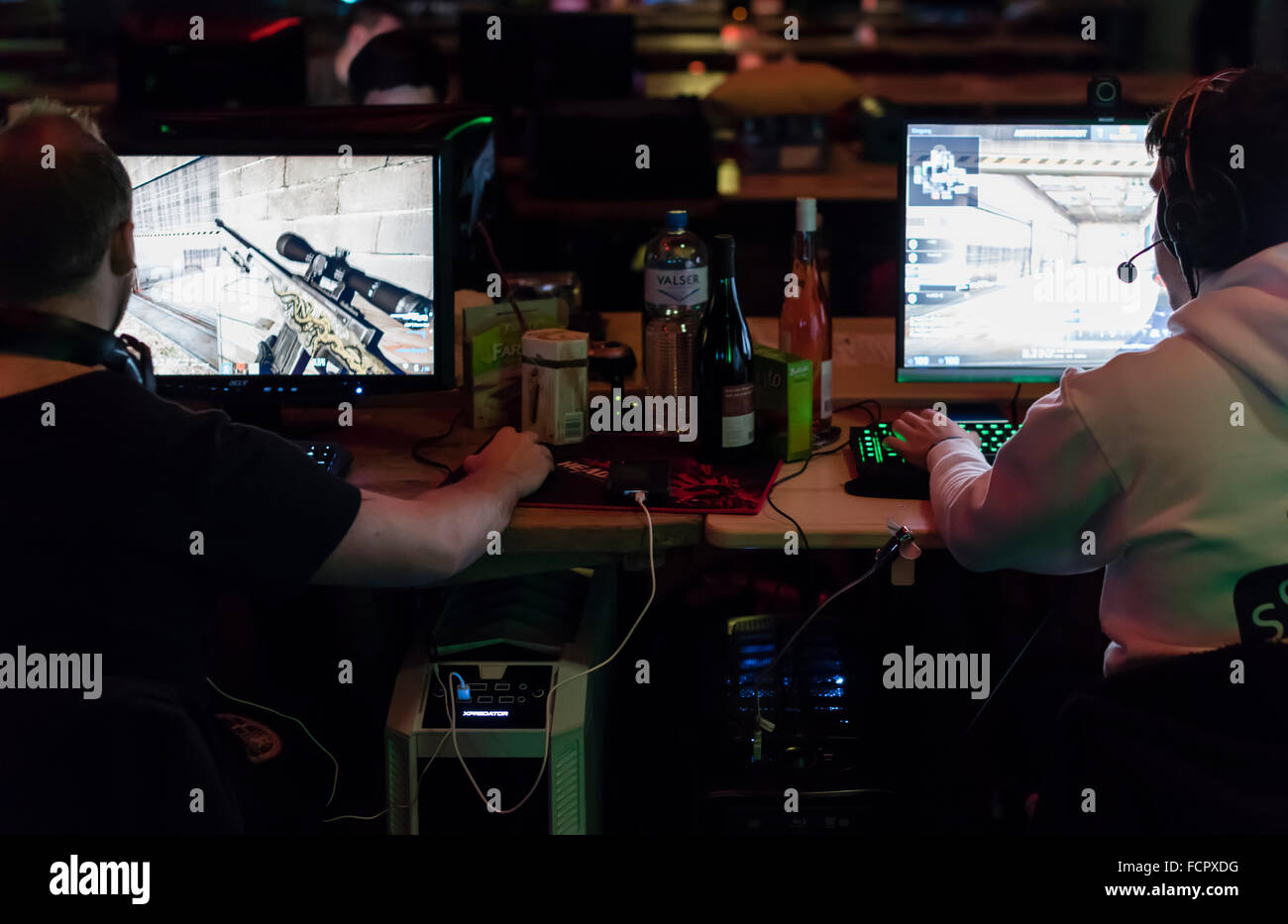 Computer game players are playing the first person shooter 'Counterstrike CS:GO' at a computer game tournament. Stock Photo