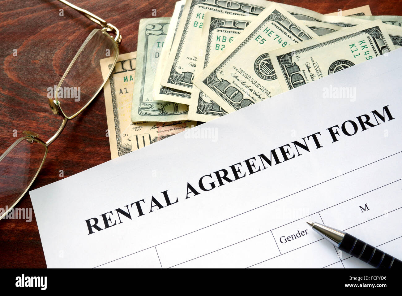 Rental agreement form on a wooden table. Stock Photo
