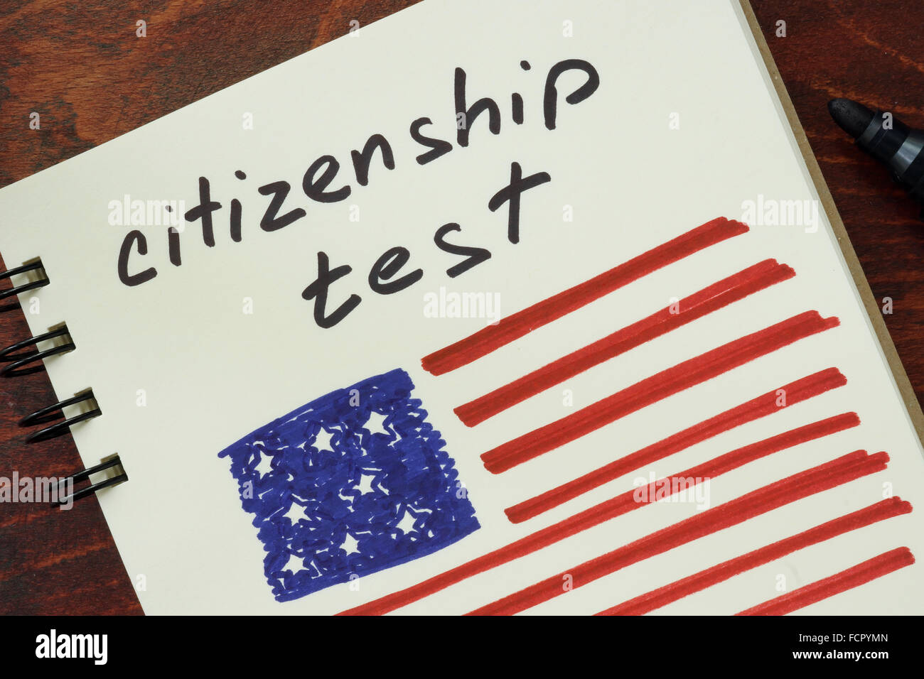 Notepad with words  citizenship test and American flag. Stock Photo