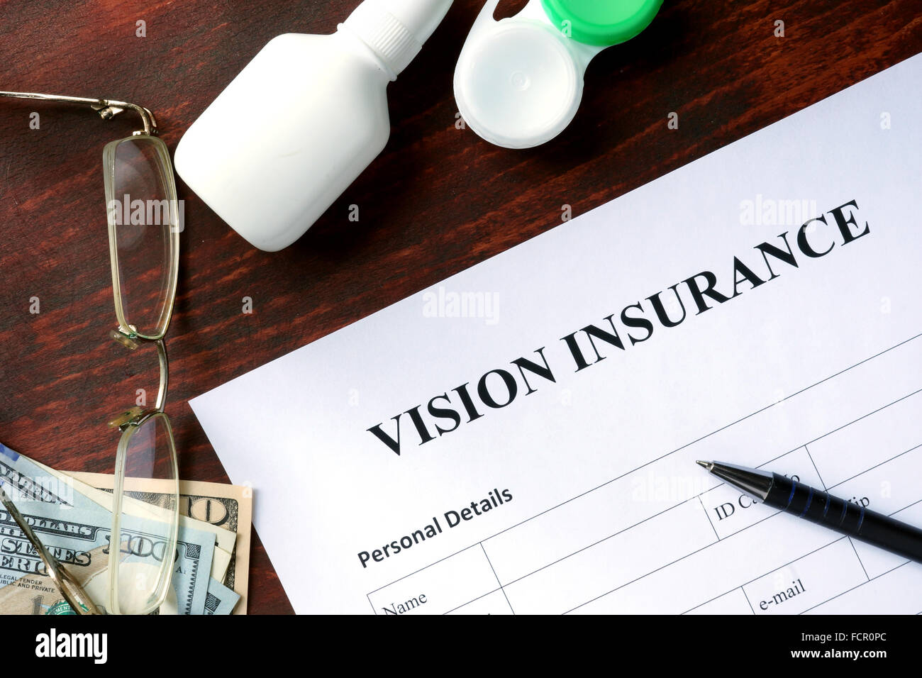 Vision insurance form on the wooden table. Stock Photo
