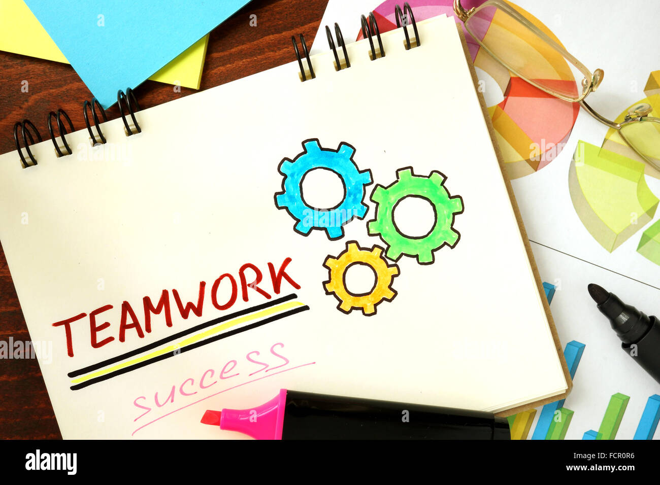 Notepad with teamwork. Business concept. Stock Photo