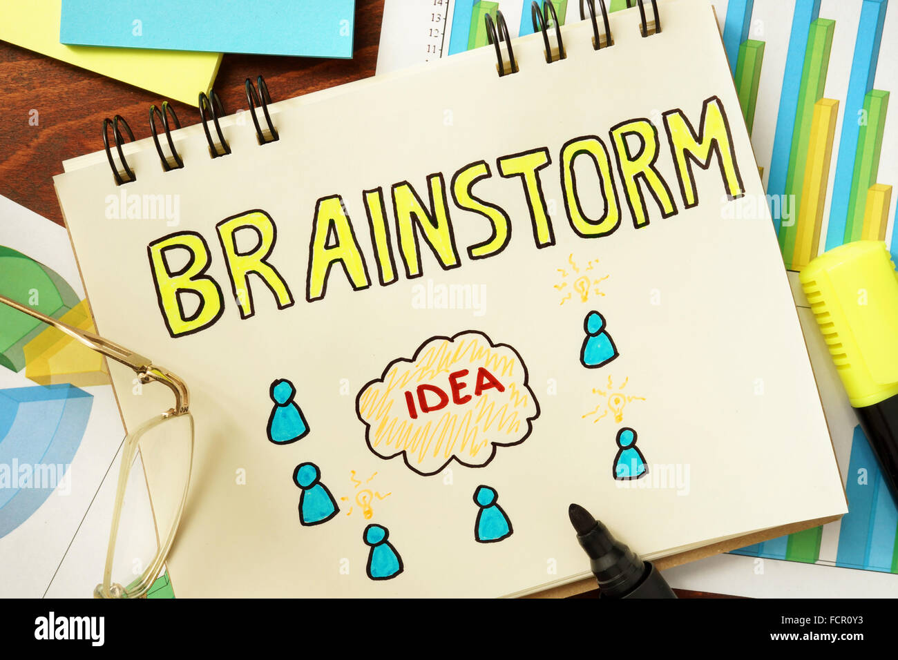 Notepad with brainstorm on the wooden table. Stock Photo