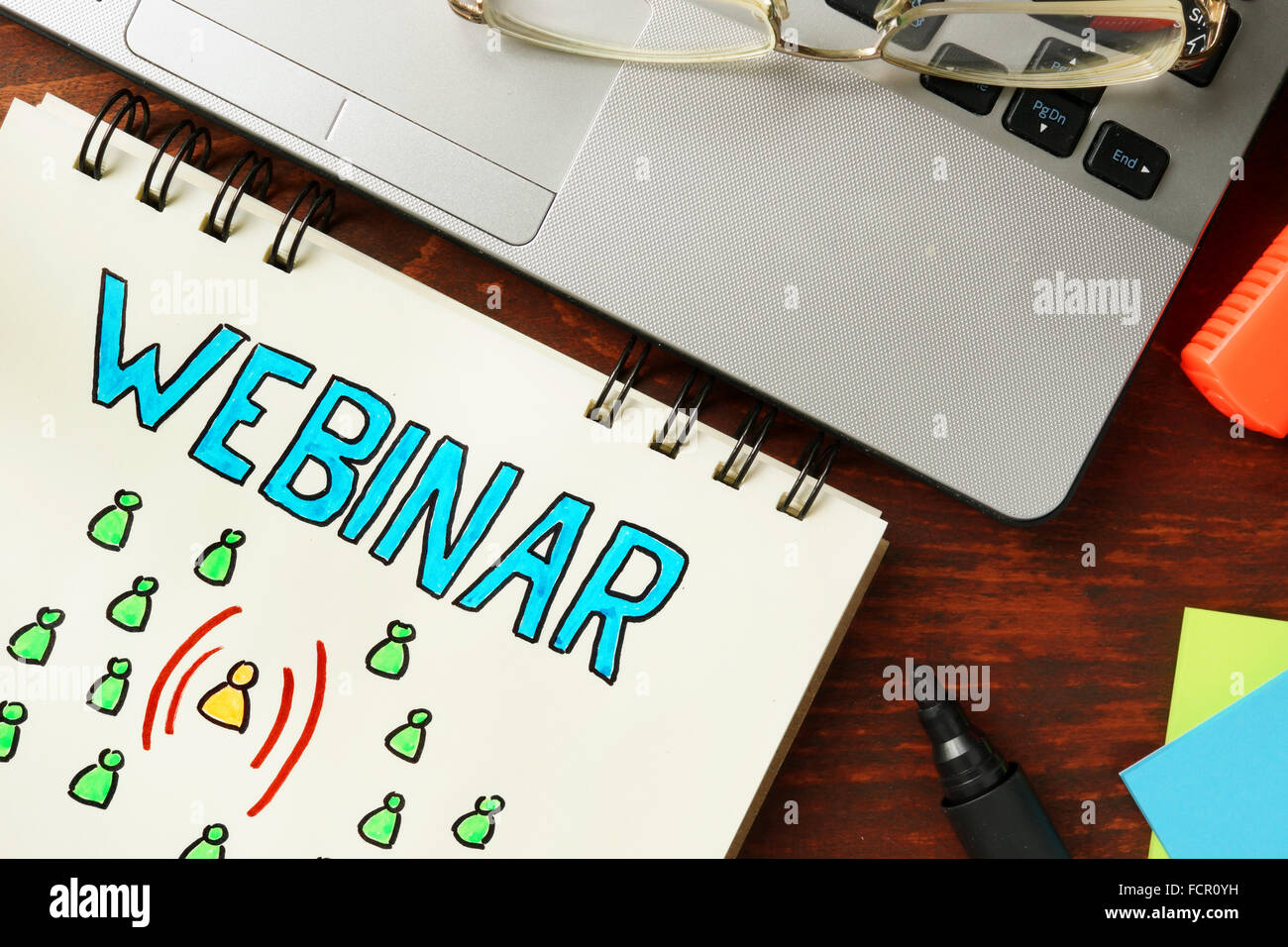 Notepad with webinar. Online seminar- education concept. Stock Photo