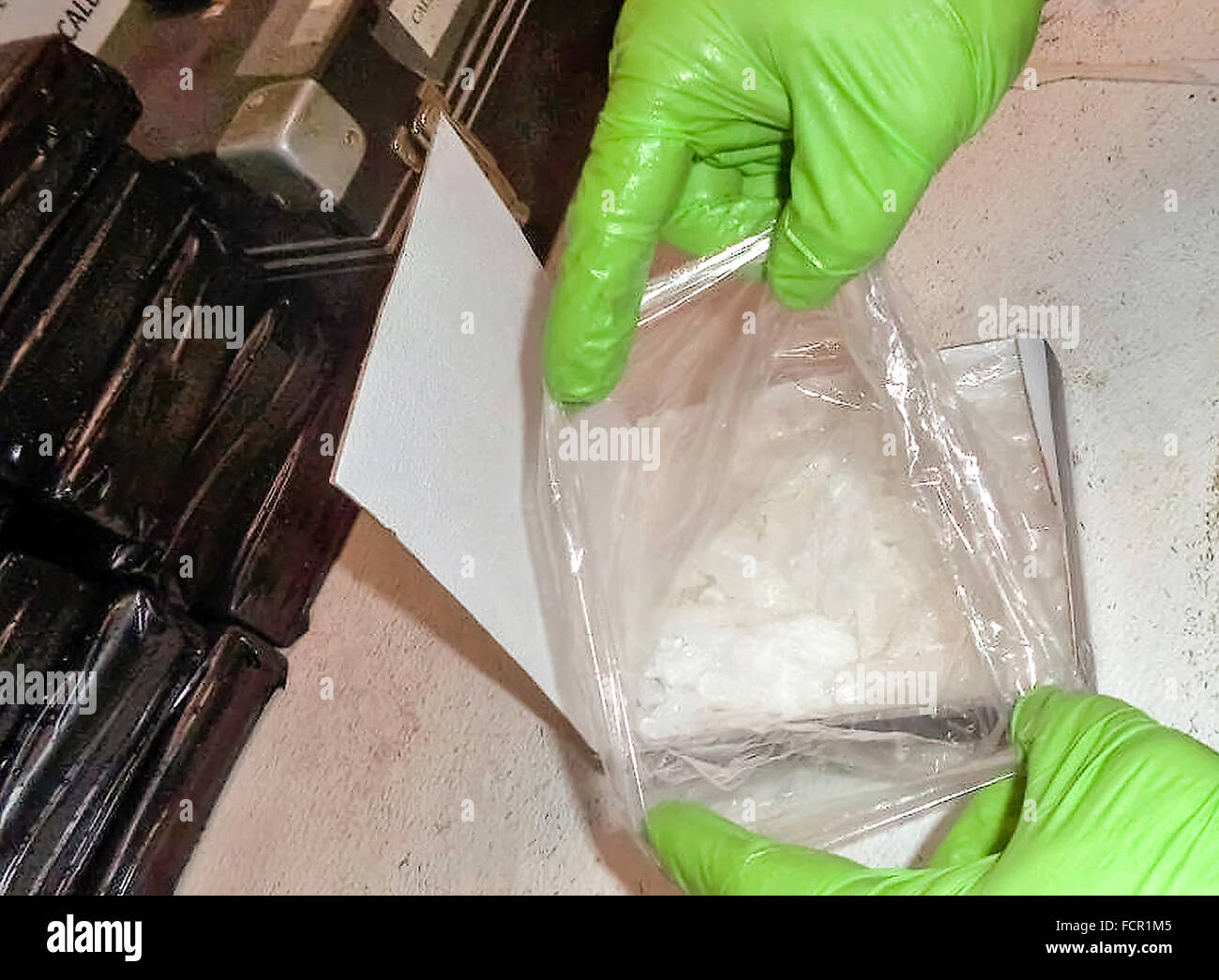 U.S. Customs and Border Protection officers at the Port of San Luis inspect over 8 Kg (19 pounds) of crystal methamphetamine with a street value of USD67,000 found hidden in a rear bumper at the Nogales-Grand Avenue (DeConcini) Border Inspection Station . See description for more information. Stock Photo