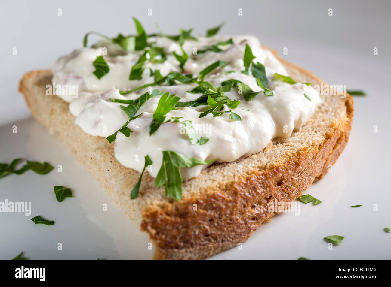 Open sandwich with cream made from cheese, horseradish and ham Stock Photo