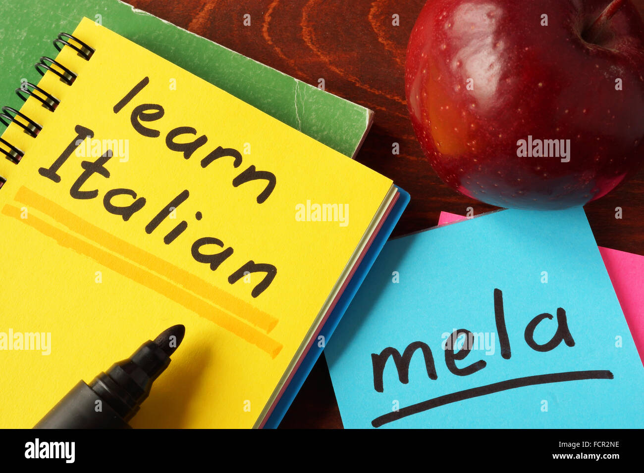 Notebook with  learn Italian sign. Education concept. Stock Photo