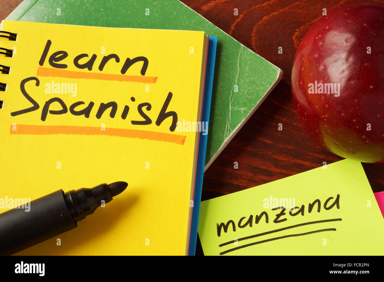 Notebook with  learn Spanish sign. Education concept. Stock Photo