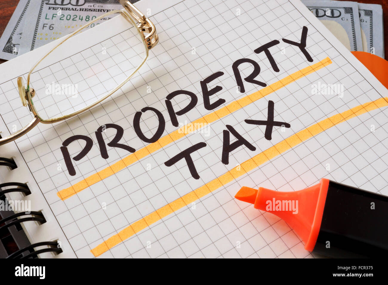 Notebook with  property tax sign on a table. Business concept. Stock Photo