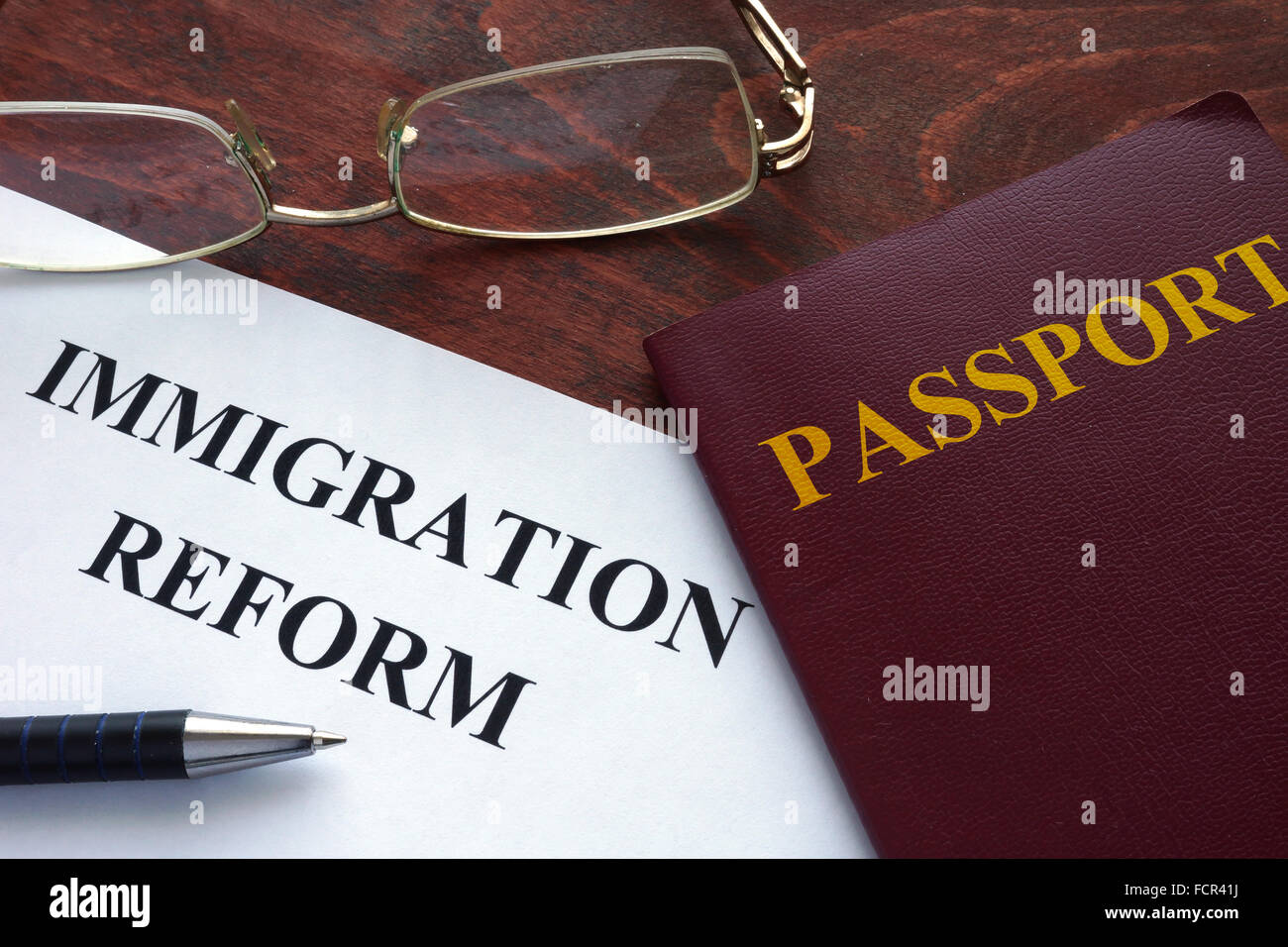 Paper with immigration reform on a table. Stock Photo