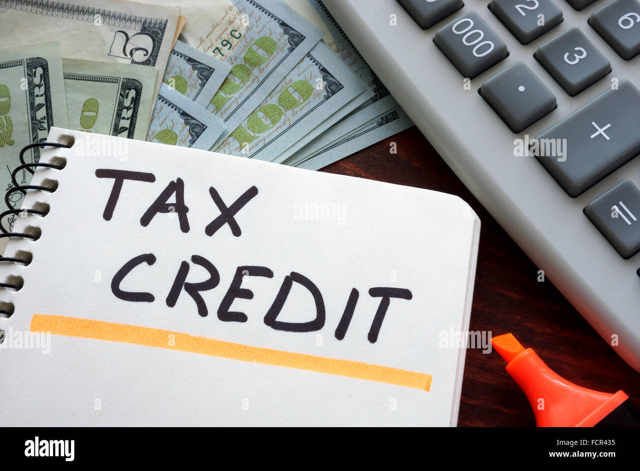 Notebook with  tax credit sign on a table. Business concept. Stock Photo