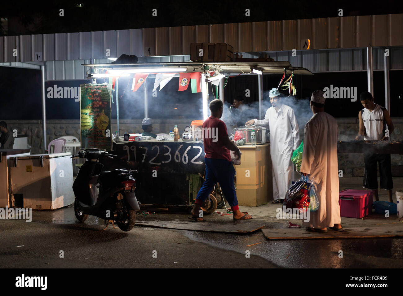 Food stand in the old town of Nizwa at night. Sultanate of Oman, Middle East Stock Photo