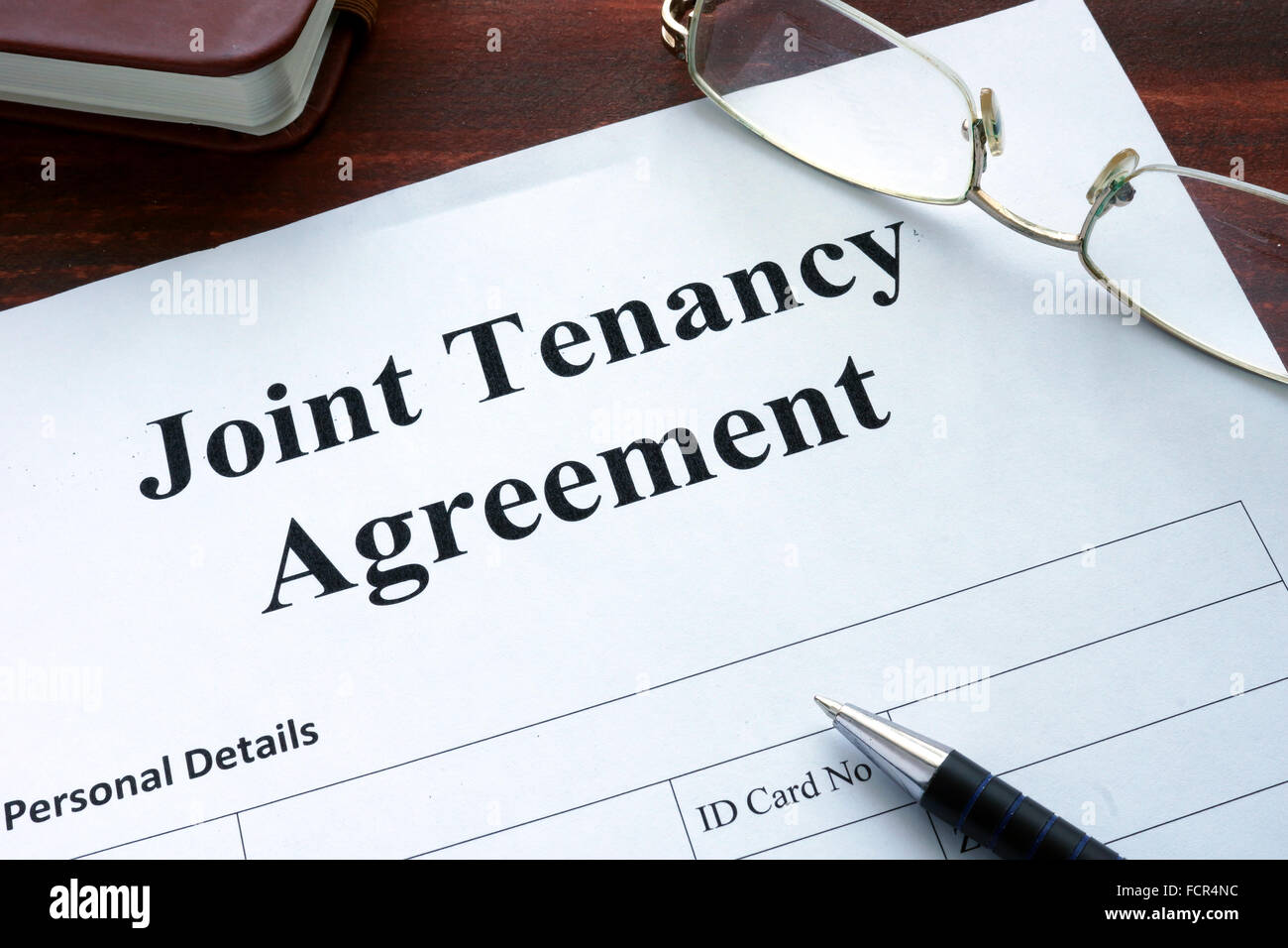 Joint Tenancy form on a table. Business concept. Stock Photo