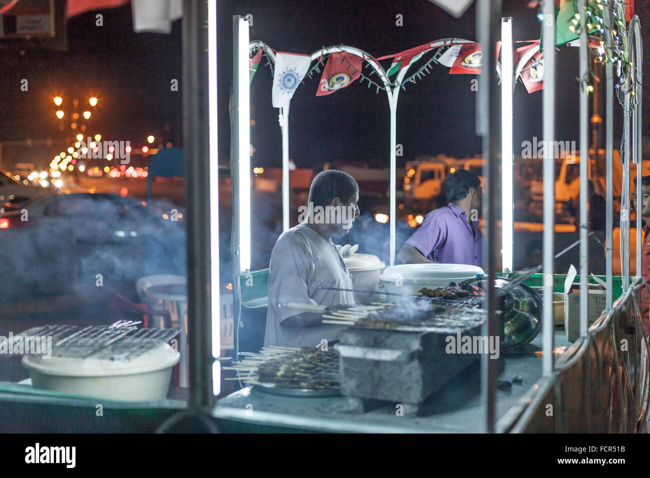 Food stand in the old town of Nizwa at night. Sultanate of Oman, Middle East Stock Photo