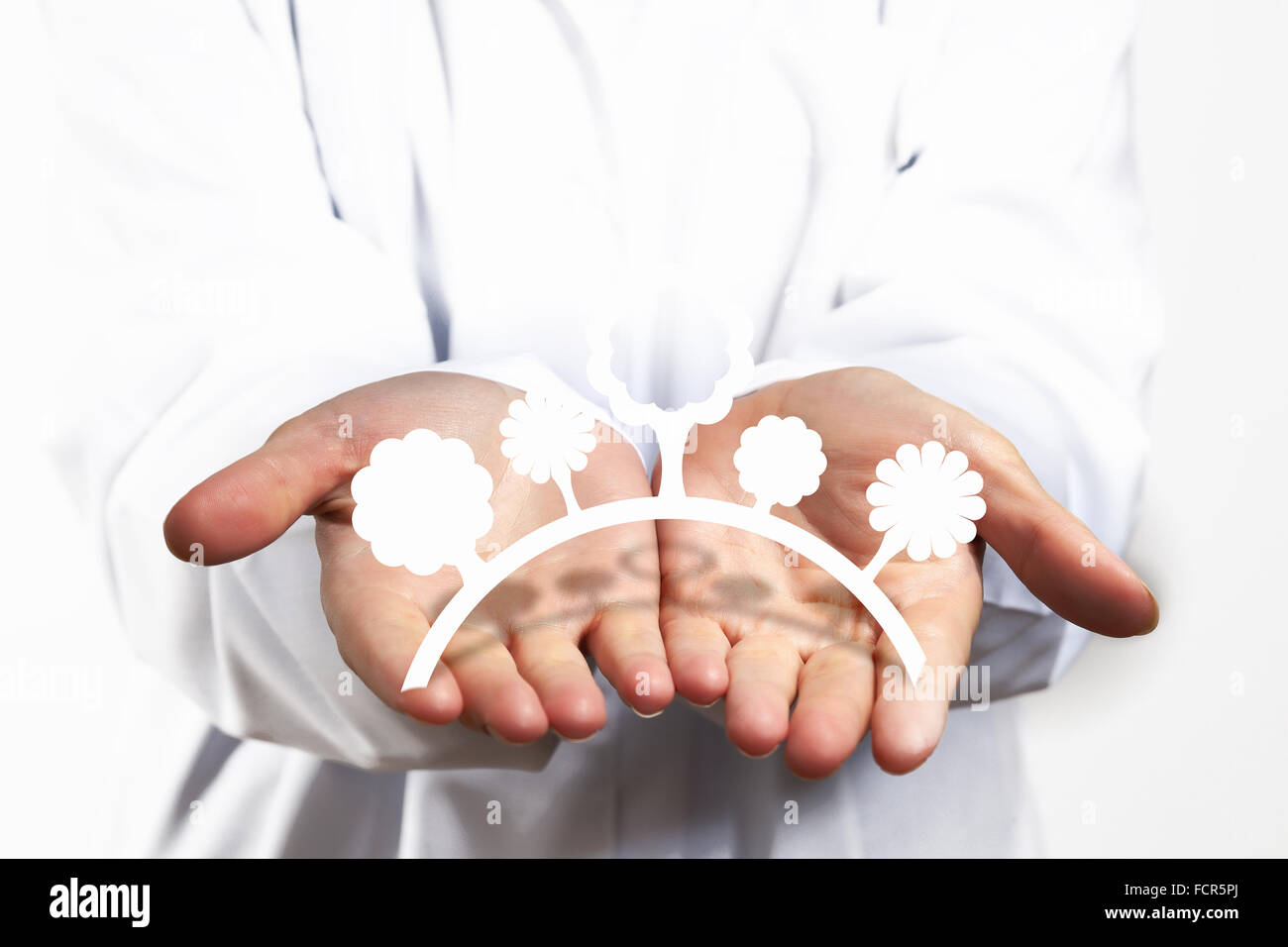 Close up of human hands with figures of nature Stock Photo - Alamy