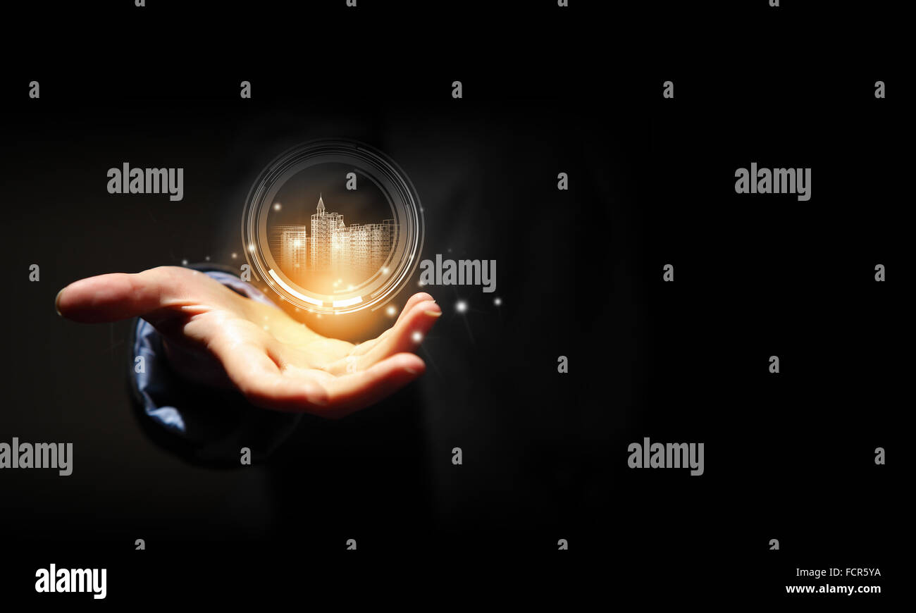 Close up of businessman hand holding digital construction model Stock ...