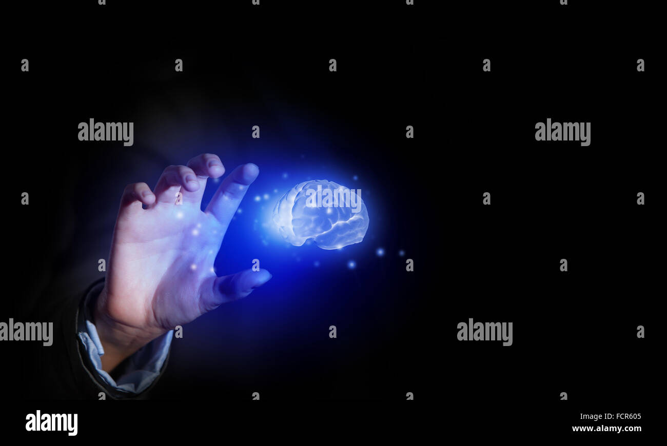 Close up of businessman holding digital image of brain in palm Stock ...