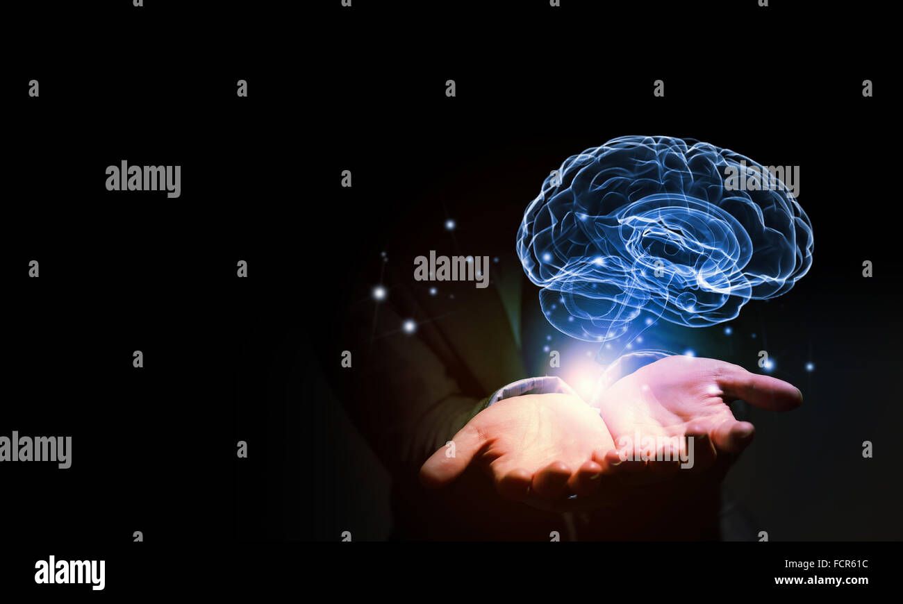 Close up of businessman holding digital image of brain in palm Stock ...