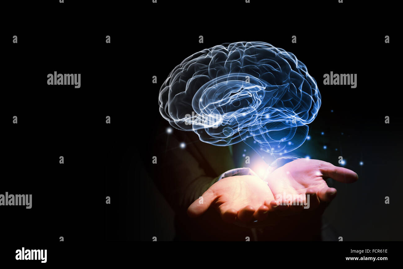 Close up of businessman holding digital image of brain in palm Stock ...