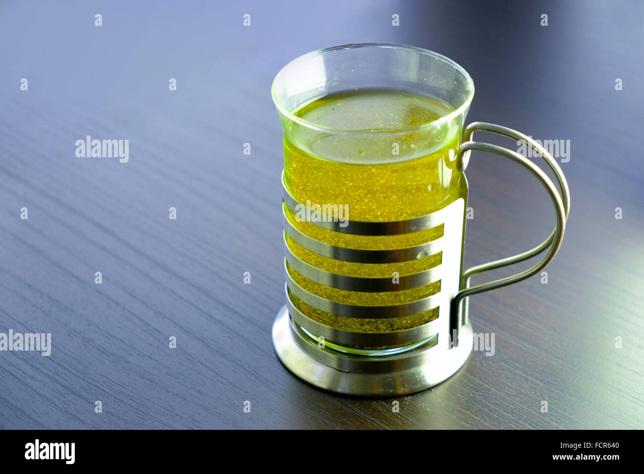 A glass of green herbal tea Stock Photo
